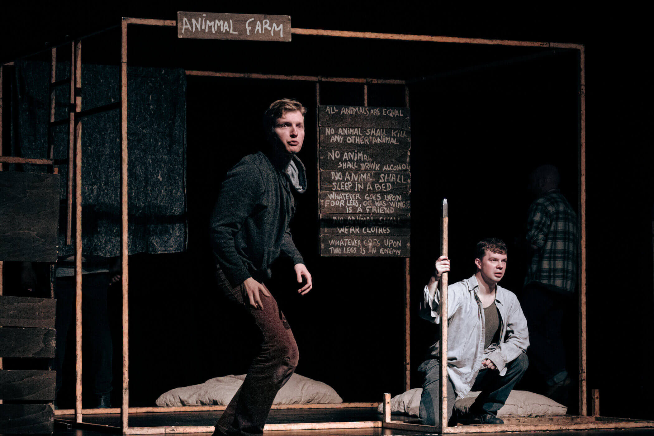 Animal farm play with two men on stage